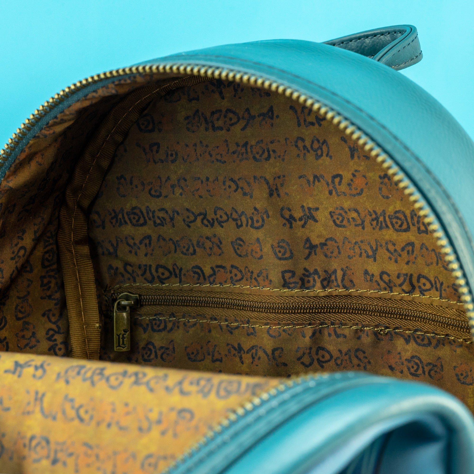 Loungefly x Disney Atlantis The Lost Empire Glow in the Dark Mini Backpack - GeekCore