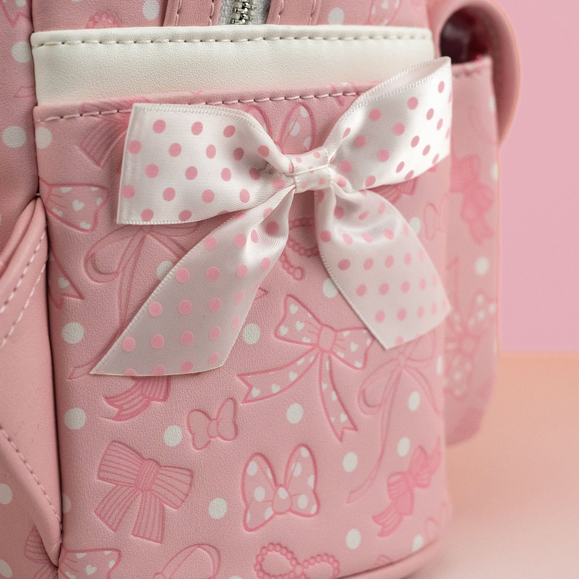 Loungefly x Disney Minnie Mouse Pink Debossed Bows Mini Backpack - GeekCore