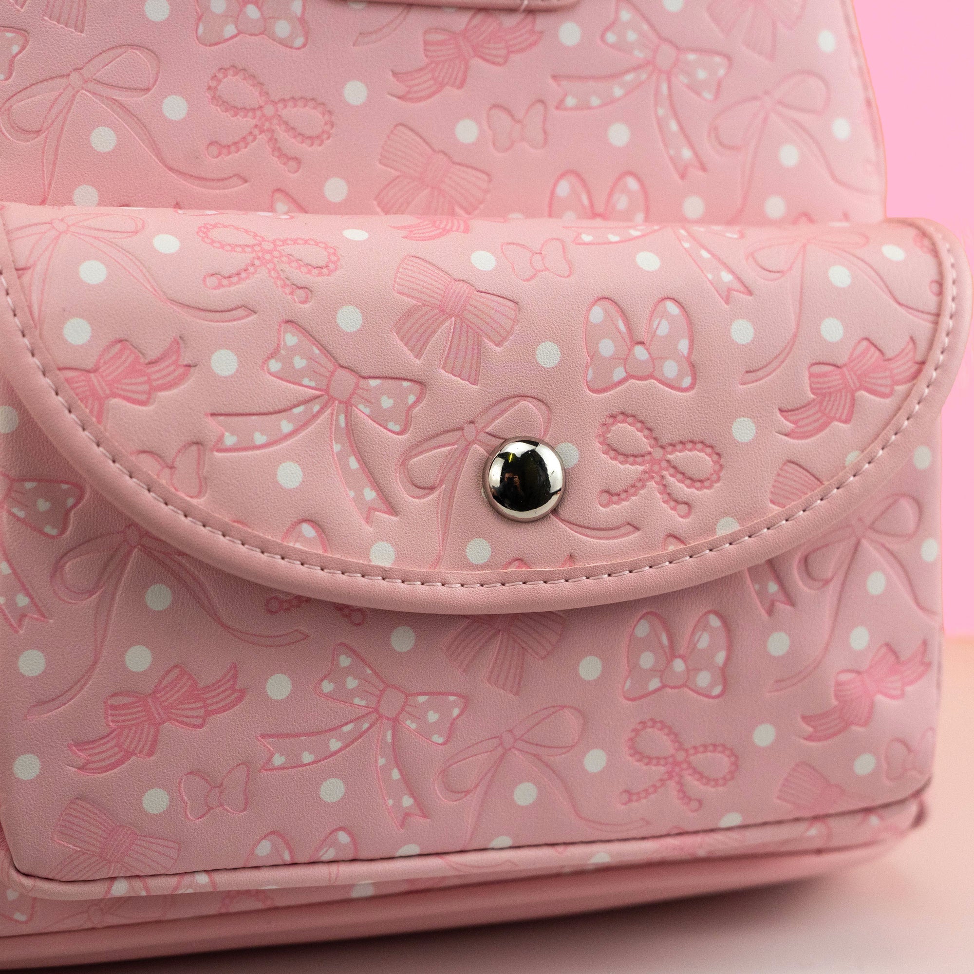 Loungefly x Disney Minnie Mouse Pink Debossed Bows Mini Backpack - GeekCore